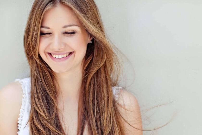 Woman smiling and looking down