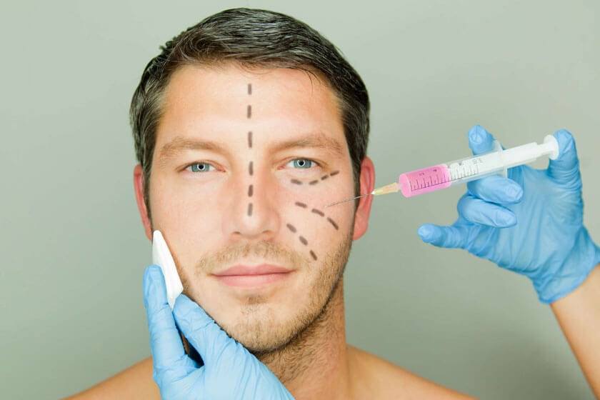 Man with surgery marks on his face getting cosmetic injections