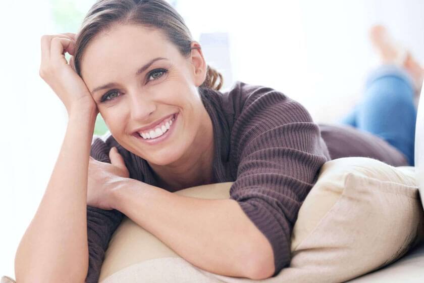 Woman lying down, smiling