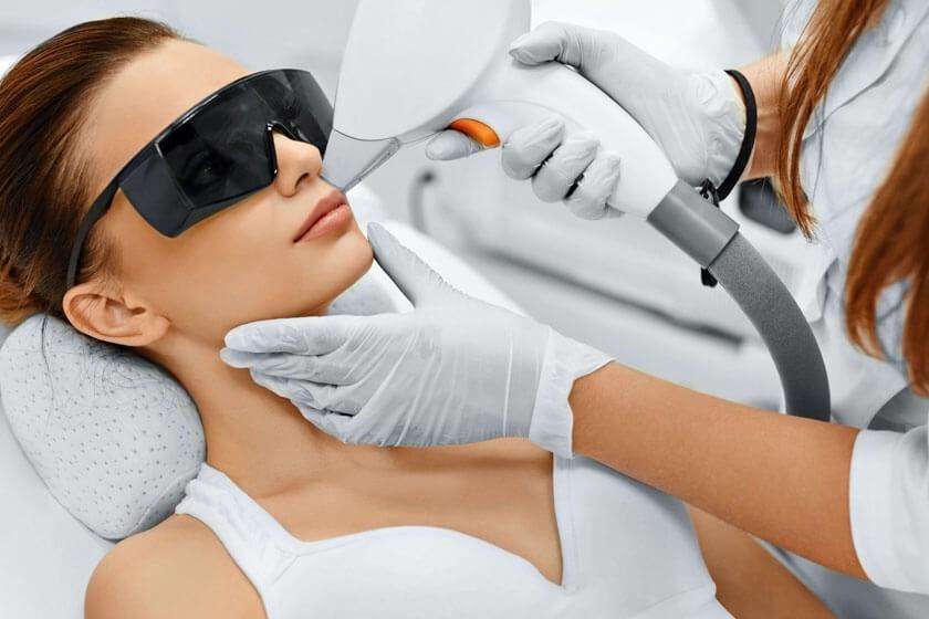 Woman receiving a laser skin treatment in The Woodlands, TX