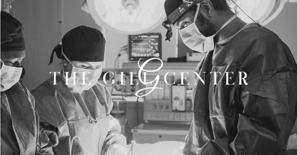 The Gill Center logo over an image of the surgical team performing a surgery at The Gill Center