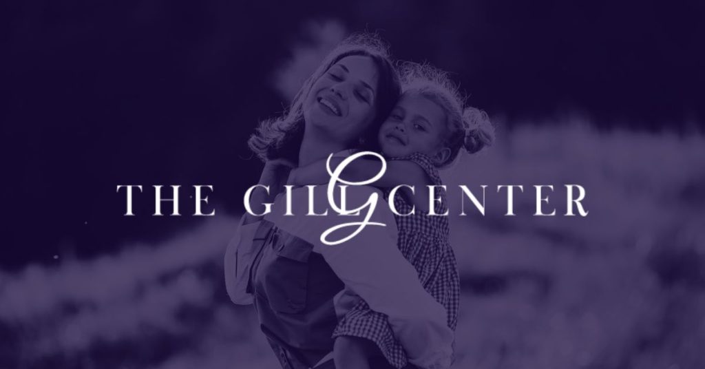 The Gill Center logo over an image of a mother and her daughter post mommy makeover recovery